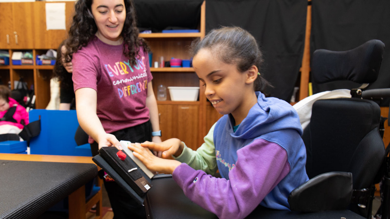 Student pressing a switch